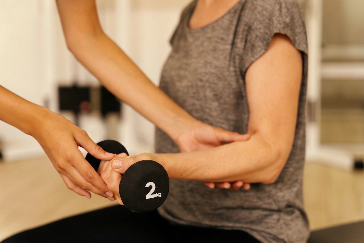 An osteopath applying a hands-on technique to a patient